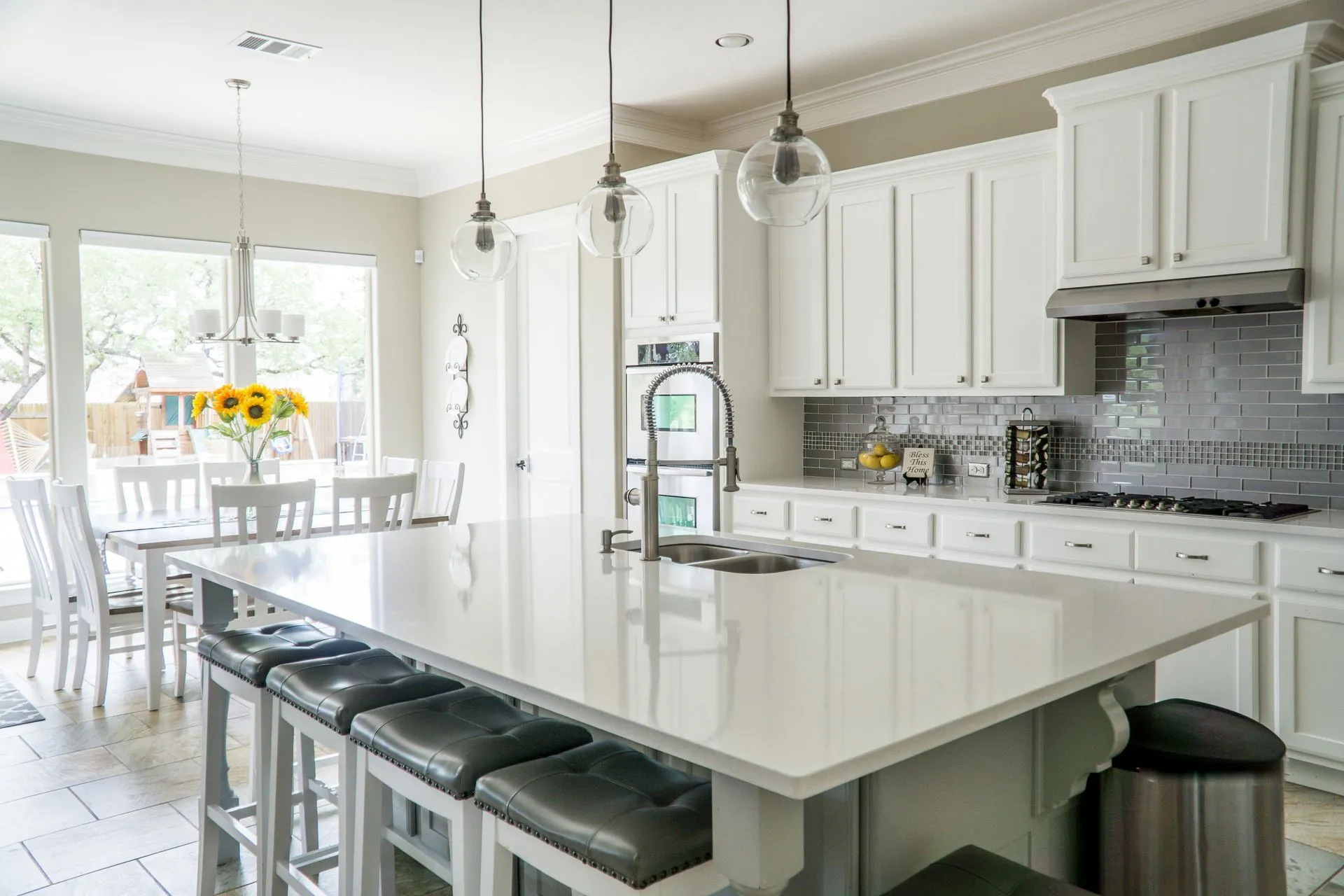 Contemporary kitchen with stone countertops and warm wood cabinetry